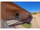 Inviting covered back patio extending to a well-kept yard at 41375 W Barcelona Dr, Maricopa, AZ 85138