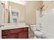 A full bathroom with a single sink vanity, tub/shower combo, and neutral colored walls at 41375 W Barcelona Dr, Maricopa, AZ 85138