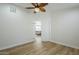 Bedroom with wood-look floors and open doorway to a sitting room at 4501 E Osage Ct, Phoenix, AZ 85044