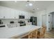 Modern kitchen with a quartz countertop island, stainless steel appliances, and bright lighting at 4501 E Osage Ct, Phoenix, AZ 85044