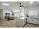 Bright, open-concept living space with a modern kitchen flowing into a comfortable living area at 4501 E Osage Ct, Phoenix, AZ 85044