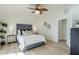 Stylized main bedroom featuring decorative pillows and wood look floors at 4501 E Osage Ct, Phoenix, AZ 85044