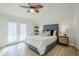 Beautifully styled main bedroom with natural light and wood look floors at 4501 E Osage Ct, Phoenix, AZ 85044