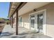 Covered patio with stained wood pillars, concrete floors, and glass doors to bring the outside in at 4501 E Osage Ct, Phoenix, AZ 85044