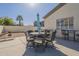 Outdoor dining set with umbrella on patio, great for entertaining or relaxing under the sun at 4541 N 129Th Dr, Litchfield Park, AZ 85340