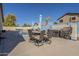 Charming outdoor dining area with table and chairs, perfect for outdoor entertaining by the pool at 4541 N 129Th Dr, Litchfield Park, AZ 85340