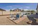 Spacious backyard featuring blue seating and a swimming pool at 4541 N 129Th Dr, Litchfield Park, AZ 85340