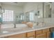 Bright bathroom features a double-sink vanity and a separate shower and toilet at 4541 N 129Th Dr, Litchfield Park, AZ 85340