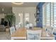 Dining area with a blue accent wall, view of the patio and backyard at 4541 N 129Th Dr, Litchfield Park, AZ 85340