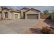 Charming single-Gathering home featuring a tile roof, a well-maintained yard, and an extended concrete driveway at 4541 N 129Th Dr, Litchfield Park, AZ 85340