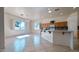 Kitchen with white island, tile flooring and ample natural light at 4541 N 129Th Dr, Litchfield Park, AZ 85340