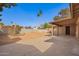 View of back porch and large backyard with a block wall fence at 4550 W Bloomfield Rd, Glendale, AZ 85304