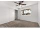 Cozy bedroom featuring plush carpeting, a ceiling fan, and a sliding-door closet at 4550 W Bloomfield Rd, Glendale, AZ 85304