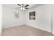 Bedroom featuring tiled floors, white walls, ceiling fan and a bright window at 4550 W Bloomfield Rd, Glendale, AZ 85304