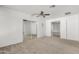 Spacious main bedroom featuring a mirrored closet, ceiling fan and access to an en suite at 4550 W Bloomfield Rd, Glendale, AZ 85304