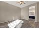 Open bedroom features hardwood floors and an arched doorway leading to the Primary bathroom at 4658 S Rufino Ln, Gold Canyon, AZ 85118