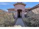 Home entrance with desert landscaping and a decorative security screen door at 4658 S Rufino Ln, Gold Canyon, AZ 85118