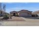 Single story home with low maintenance desert landscaping, a neutral palette and a private two-car garage at 4658 S Rufino Ln, Gold Canyon, AZ 85118