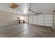 Spacious garage with automatic door, ample storage, and built-in workbench at 4658 S Rufino Ln, Gold Canyon, AZ 85118