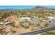 Aerial view of modern home with a private pool, landscaped yard, and desert surroundings, showcasing its serene location at 5468 E Dove Valley Rd, Cave Creek, AZ 85331