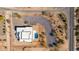 Overhead perspective of house with pool, desert landscape and rock features at 5468 E Dove Valley Rd, Cave Creek, AZ 85331