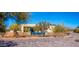 View of the desert house with pool and desert landscaping at 5468 E Dove Valley Rd, Cave Creek, AZ 85331