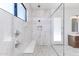 Modern bathroom features a glass-enclosed shower with bench and dual shower heads at 5468 E Dove Valley Rd, Cave Creek, AZ 85331