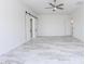 Bright bedroom with ceiling fan, recessed lighting, closet, and elegant sliding barn doors at 5468 E Dove Valley Rd, Cave Creek, AZ 85331