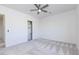 Bright bedroom featuring neutral walls, carpet floors, and a closet at 5468 E Dove Valley Rd, Cave Creek, AZ 85331