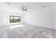 Bright bedroom with neutral walls, carpet floors, a ceiling fan and a large window at 5468 E Dove Valley Rd, Cave Creek, AZ 85331