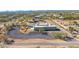 Back exterior of a modern house with a pool and desert landscape at 5468 E Dove Valley Rd, Cave Creek, AZ 85331