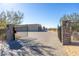 Beautiful gated entrance leading to the home with a long paved driveway at 5468 E Dove Valley Rd, Cave Creek, AZ 85331