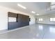 Clean garage featuring custom cabinetry, ample storage, and epoxy flooring at 5468 E Dove Valley Rd, Cave Creek, AZ 85331