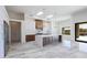 Bright, open kitchen with stainless steel appliances, marble countertops and designer pendant lighting at 5468 E Dove Valley Rd, Cave Creek, AZ 85331