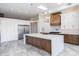 Bright kitchen featuring a center island, stainless steel refrigerator, and pendant lighting at 5468 E Dove Valley Rd, Cave Creek, AZ 85331