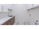 Bright laundry room with ample storage, countertop space, and modern sink at 5468 E Dove Valley Rd, Cave Creek, AZ 85331