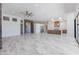 Expansive living room with fireplace, ceiling fan, and natural lighting at 5468 E Dove Valley Rd, Cave Creek, AZ 85331