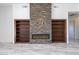 Cozy living room features a stone fireplace flanked by built-in bookshelves at 5468 E Dove Valley Rd, Cave Creek, AZ 85331