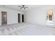 Bright main bedroom featuring neutral walls, carpet floors, a ceiling fan and access to the patio at 5468 E Dove Valley Rd, Cave Creek, AZ 85331