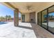 Covered patio featuring stone pillars, an outdoor fireplace, and access to a pool at 5468 E Dove Valley Rd, Cave Creek, AZ 85331