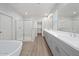 Bathroom featuring double sinks, separate shower, and tub at 550 W Copper Way, Chandler, AZ 85225