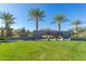 Welcoming community entrance with lush landscaping and a modern sign, creating a positive first impression at 5624 S Winchester --, Mesa, AZ 85212