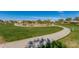 Expansive community park featuring lush greenery, walking paths, and desert landscaping for outdoor recreation and enjoyment at 5624 S Winchester --, Mesa, AZ 85212