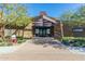 Attractive community center entrance with stone accents, desert landscaping, and brick walkway at 5624 S Winchester --, Mesa, AZ 85212