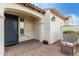 Inviting front porch area with a cozy chair and a glimpse of the front door at 5624 S Winchester --, Mesa, AZ 85212