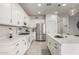 Bright kitchen featuring white cabinetry, stainless steel appliances, and a large center island at 5624 S Winchester --, Mesa, AZ 85212