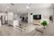 Inviting living area with a view into the kitchen and dining area with a ceiling fan at 5624 S Winchester --, Mesa, AZ 85212