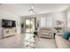 Comfortable living room with neutral decor and a glass coffee table and natural light at 5624 S Winchester --, Mesa, AZ 85212