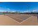 Well-maintained community tennis court with professional surfacing and lighting for daytime or evening play at 5624 S Winchester --, Mesa, AZ 85212