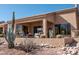 Enjoy outdoor living on this back patio, complete with seating and desert landscaping at 5705 S Pinnacle Ln, Gold Canyon, AZ 85118